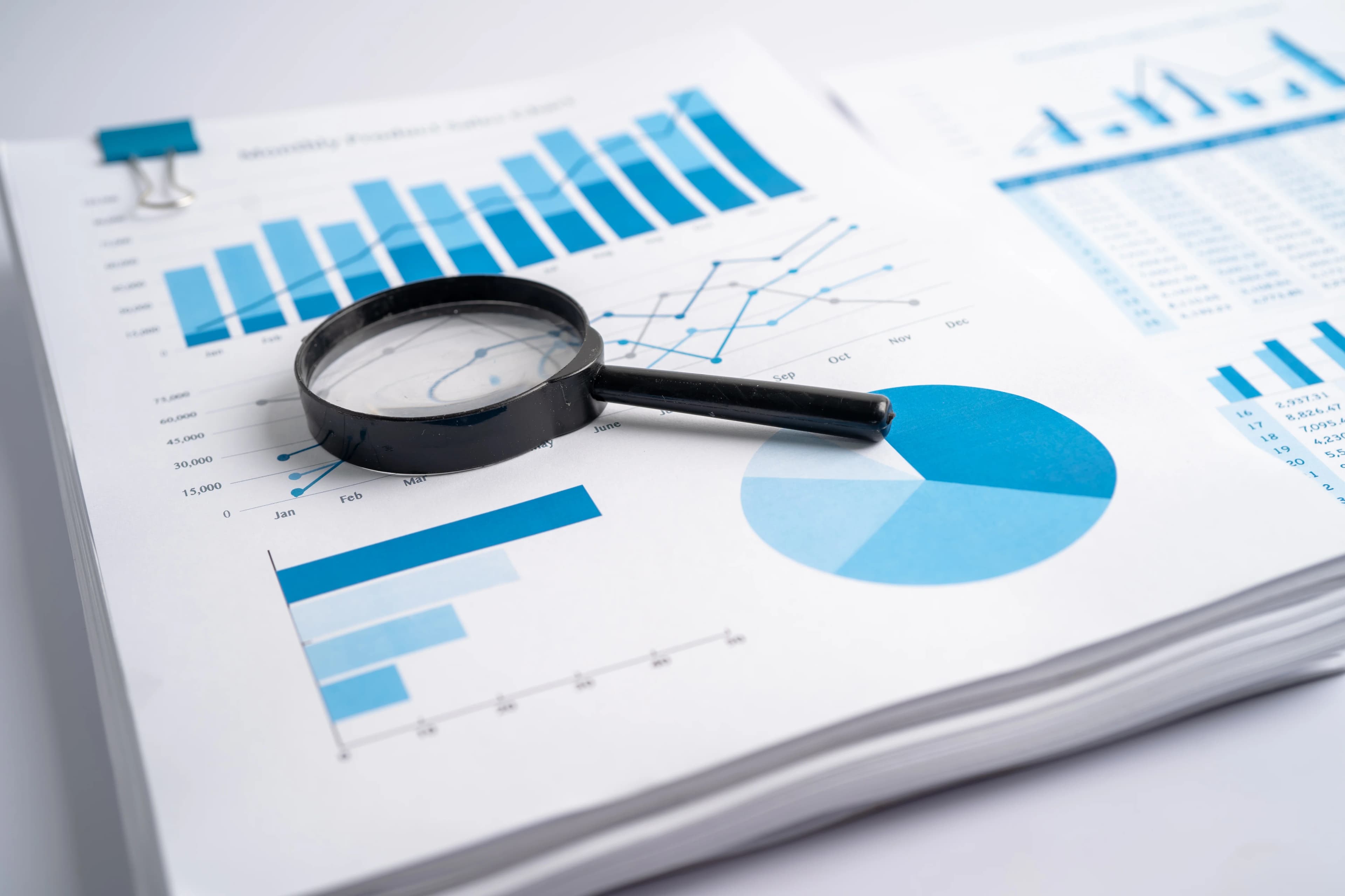 magnifying-glass-on-chart-graph-for-analysis-accou